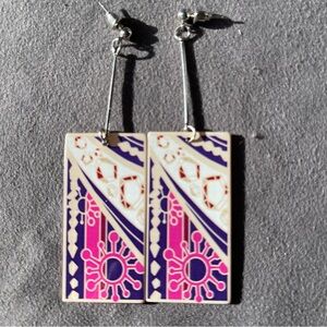 Long colorful floral abstract pattern resin earrings with silver tone posts.